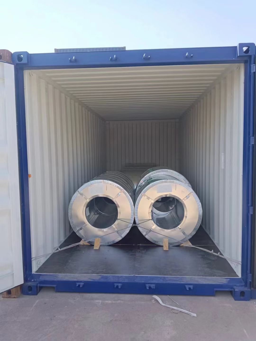 Is it more suitable to ship steel coils in containers by sea or by truck?