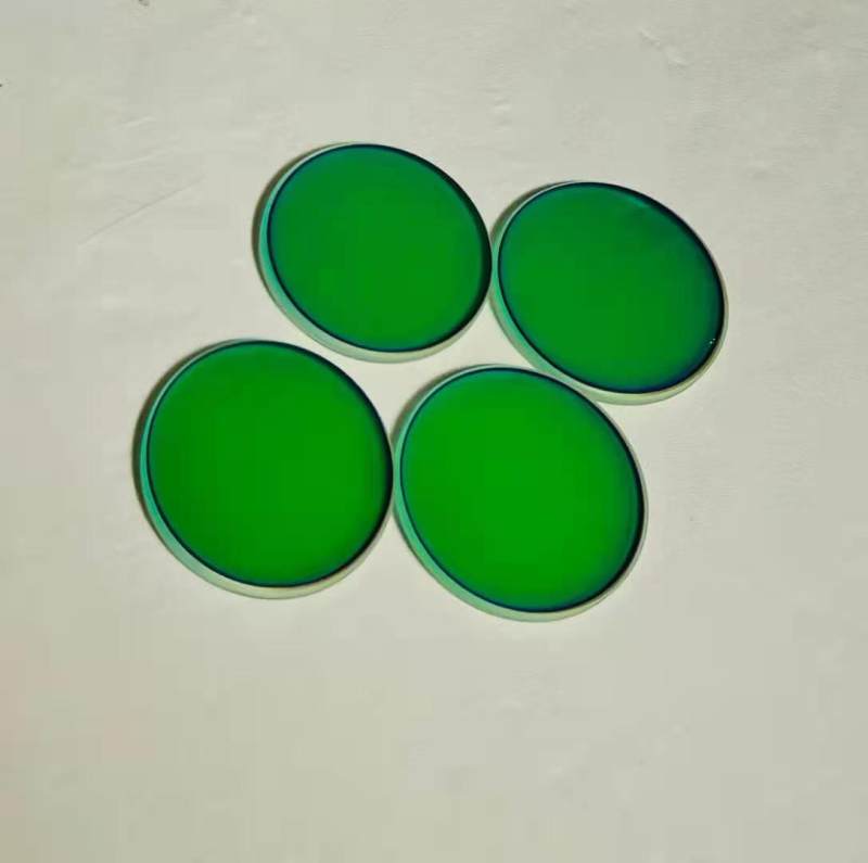 Reflecting green through blue optical lenses