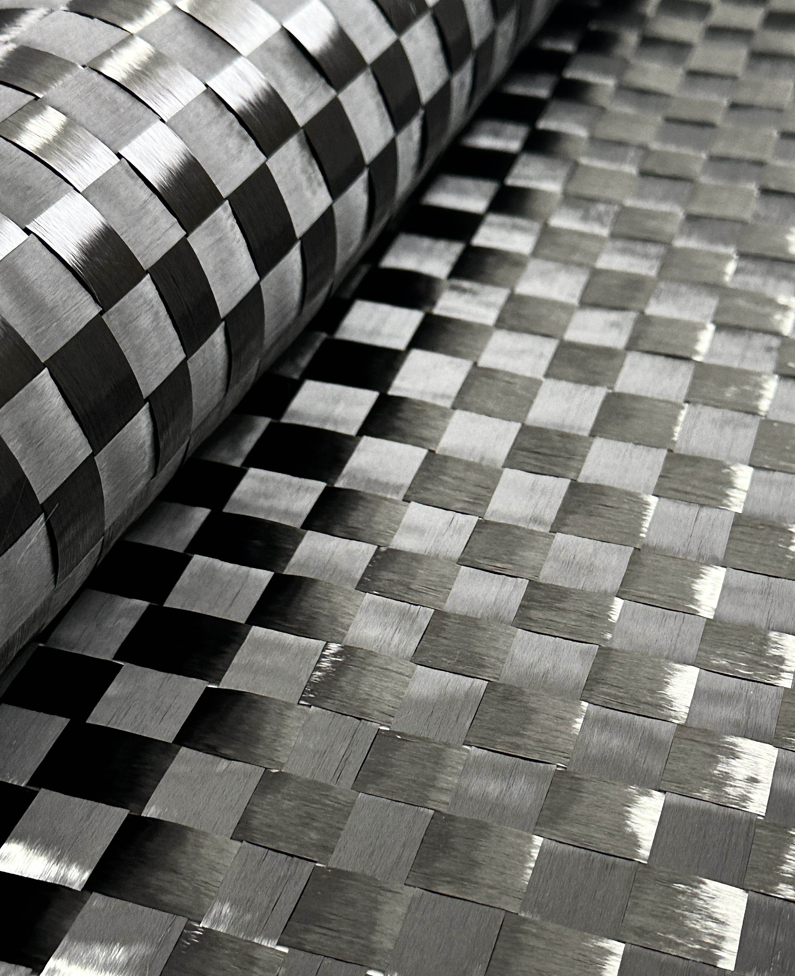 Spread tow carbon fiber prepreg