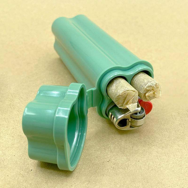 Hermit crab tobacco one piece clamshell cigarette case kit with two holes containing a lighter for portable storage